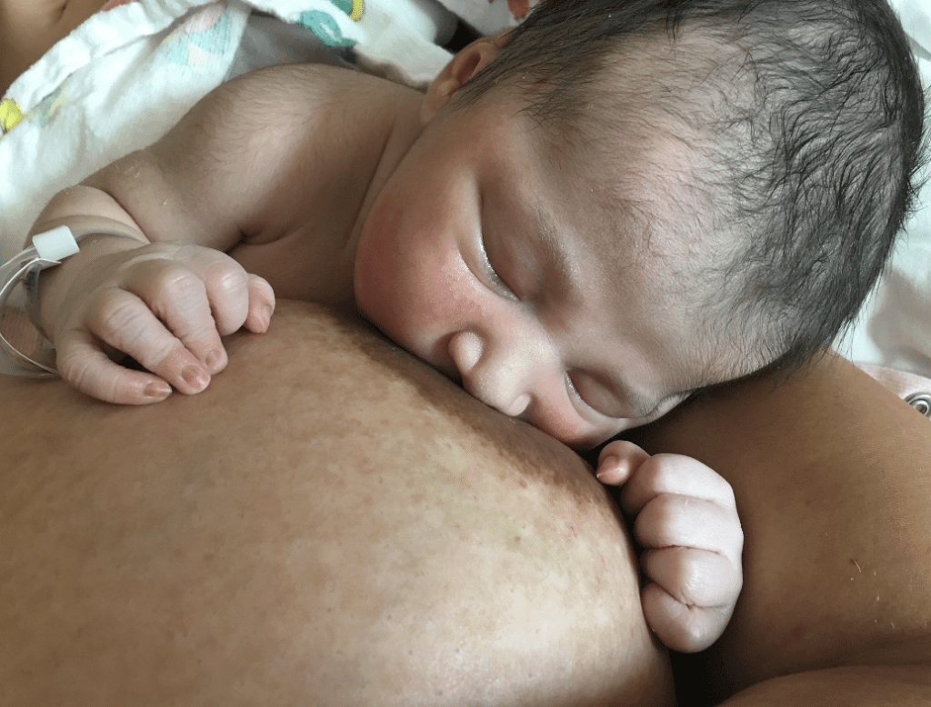 Sleepy baby breastfeeding