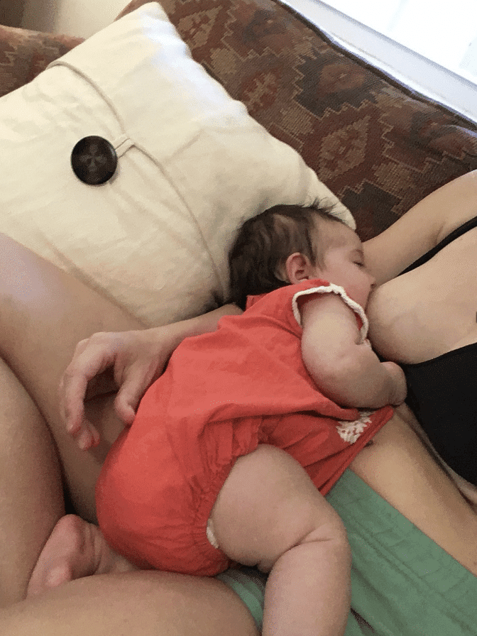 Cradle hold (baby nursing from same breast that mom is holding with).